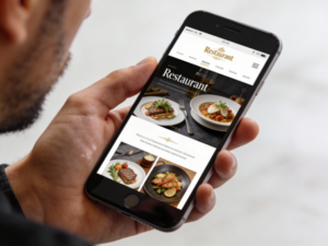 A man holding a smartphone, browsing a restaurant’s website, focusing on the screen while sitting at a table, suggesting interest in checking the menu or making a reservation