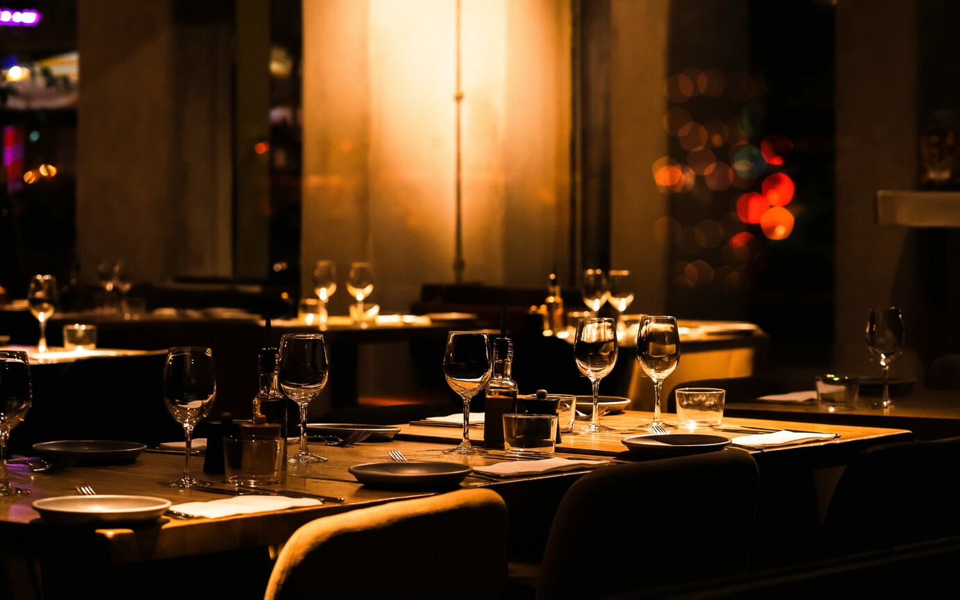 A modern restaurant interior in Singapore, featuring warm lighting, contemporary furnishings, and a thoughtfully designed dining layout that reflects the city’s vibrant food culture