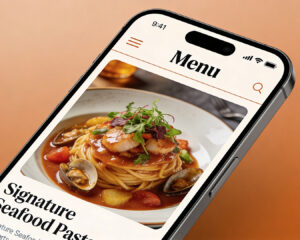 A smartphone displaying a beautifully plated dish, capturing the details of the food through the camera screen in a warm, inviting light.
