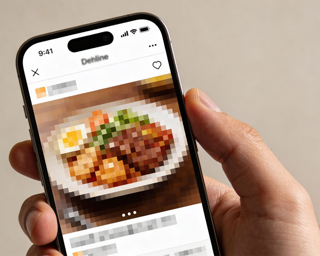 A phone screen showing a low-resolution photo of food, making the dish appear unclear and unappetising.