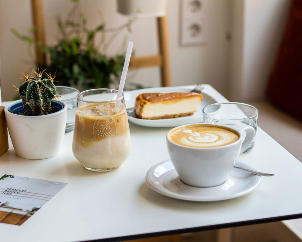 A delicate dessert presented on a café table, styled with soft lighting and a relaxed setting that evokes comfort and indulgence.