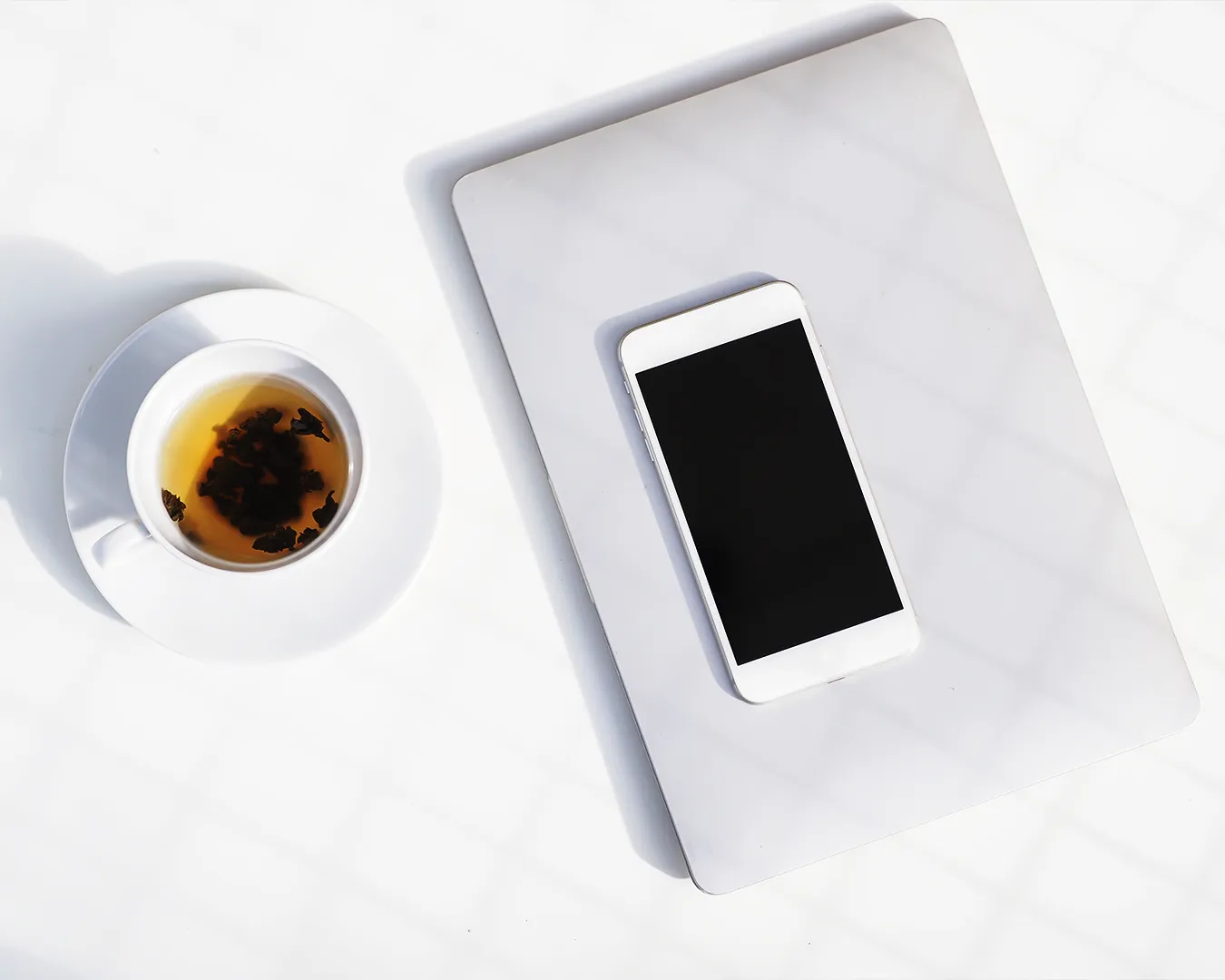 Mobile phone and tablet on table showing importance of responsive restaurant website design for Singapore F&B businesses