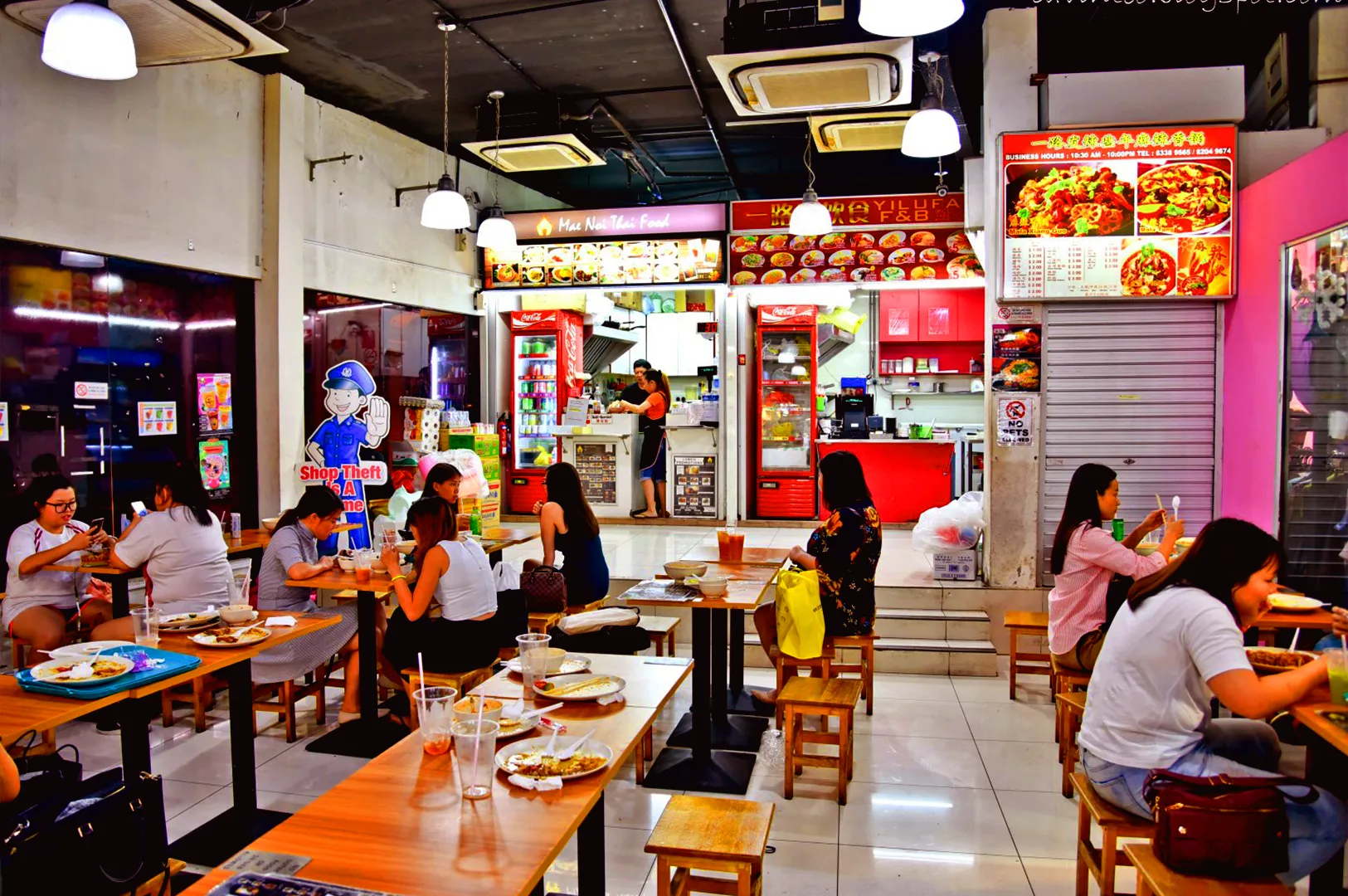 Busy hawker-style restaurant in Singapore with diners, showcasing local small business F&B operations and everyday customer traffic