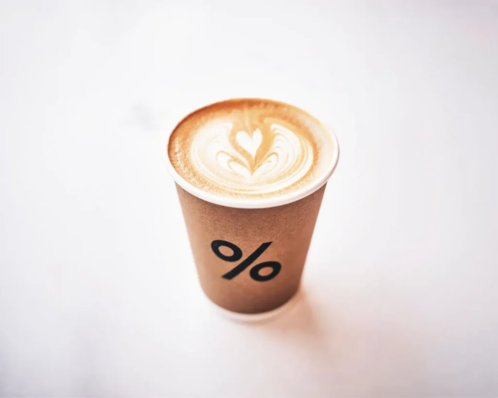 Simple logo printed on takeaway coffee cup in Singapore, showing effective small-scale branding and logo clarity