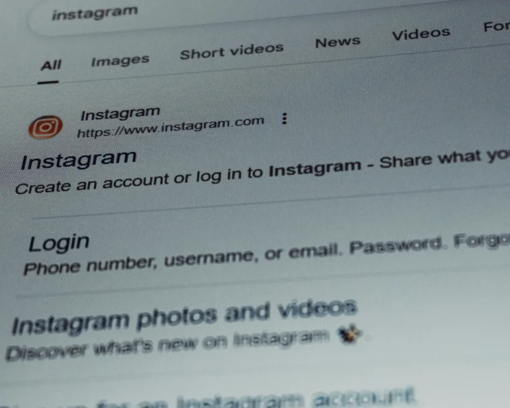 A close-up of a computer screen displaying search results for Instagram. The page shows options to log in or create an account, with tabs for images, videos, and more.