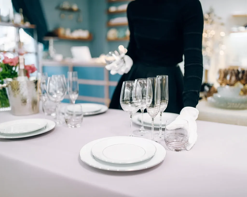 Elegant restaurant table setup with polished glassware and refined service details reflecting luxury dining rebrand and elevated guest experience