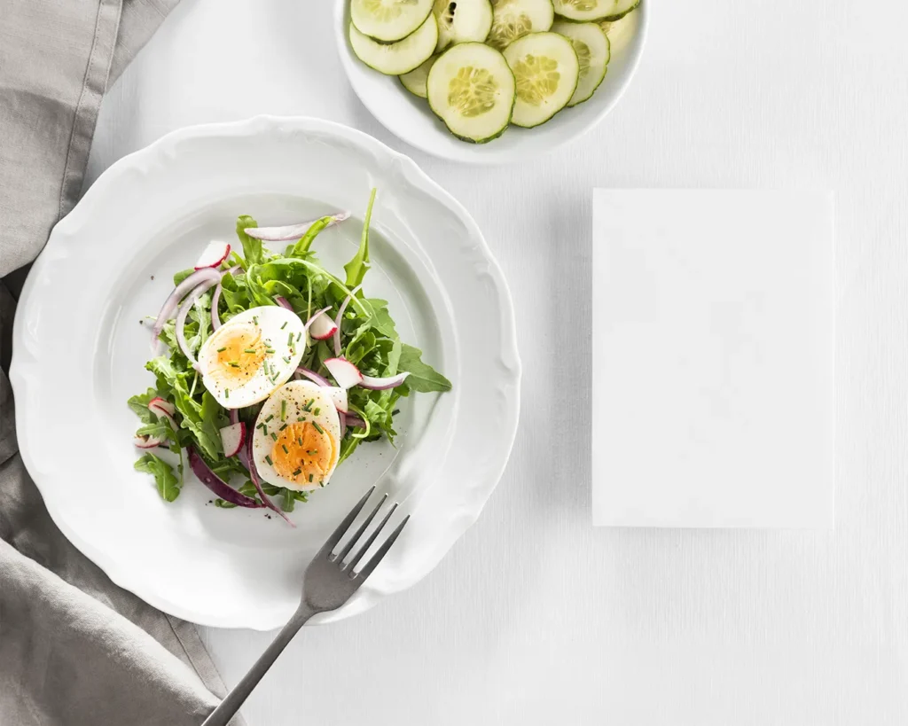Restaurant branding budget Singapore visual with minimalist food styling and blank brand identity card on white table