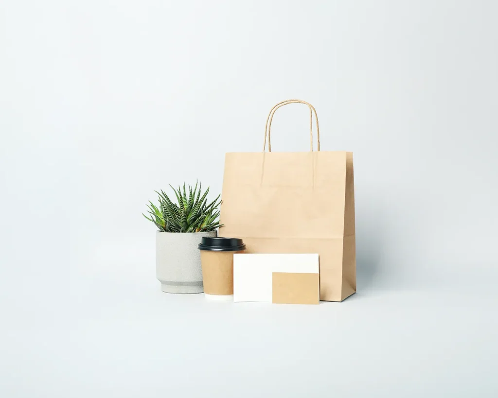 Clean restaurant packaging mockup with takeaway bag, coffee cup, and blank branding materials for modern food and beverage identity design