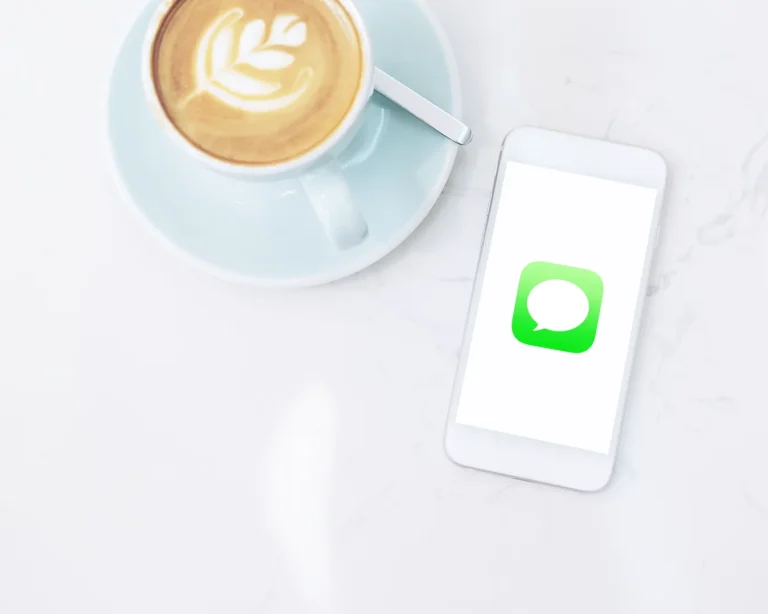Restaurant SMS marketing flat lay with coffee and smartphone on marble table