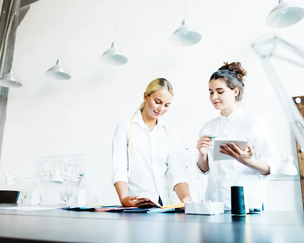 Restaurant team reviewing creative concepts and operational details together, highlighting collaboration, brand development, and hospitality content creation.