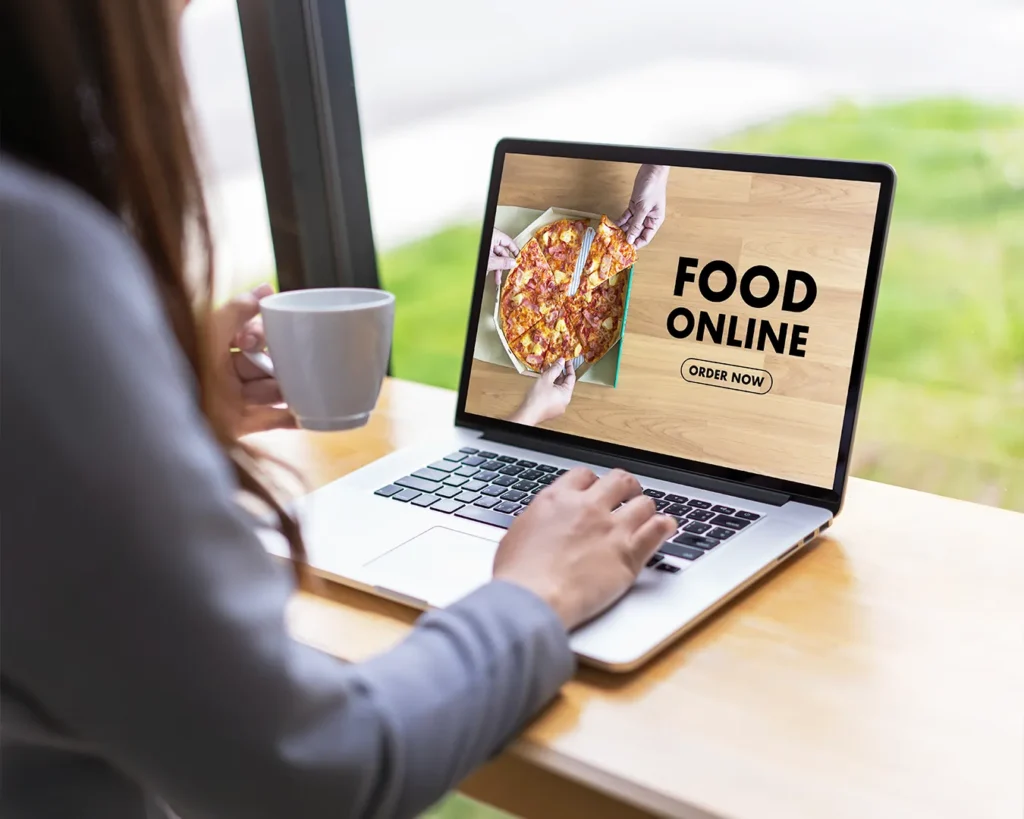 Online restaurant ordering website on laptop, restaurant website optimization, digital brand alignment, customer engagement through online presence