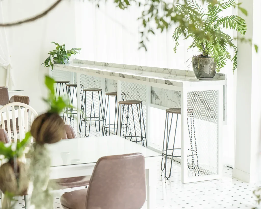 Bright minimalist café interior with marble counter and modern restaurant brand identity design