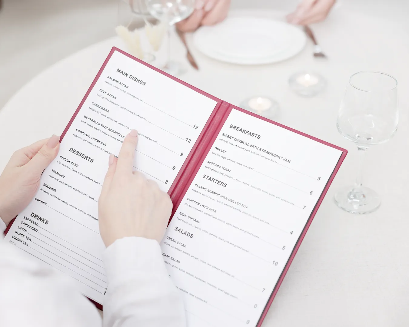 Guest reading a professionally designed restaurant menu, showcasing clear typography, menu layout, and premium restaurant branding.