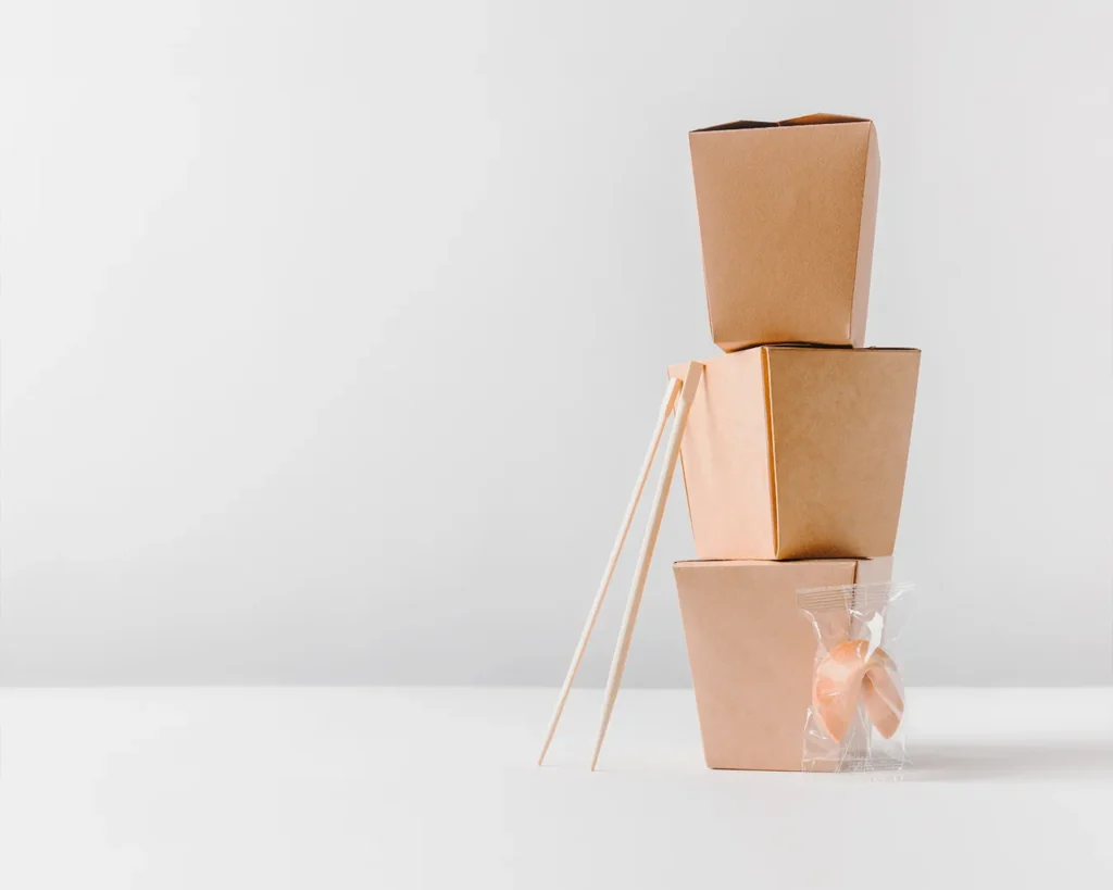 Minimalist takeaway packaging arrangement symbolizing premium food delivery experience and memorable customer service