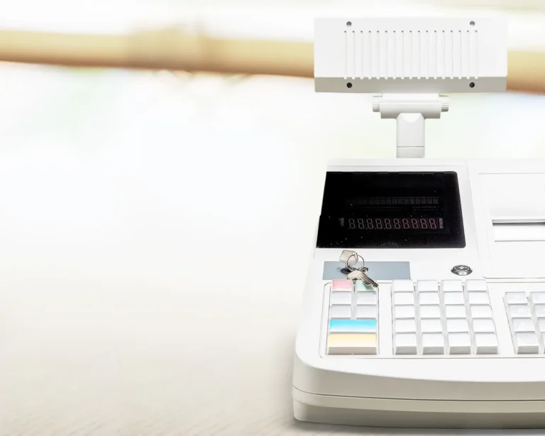Traditional cash register POS system with keypad and receipt printer for restaurant transactions
