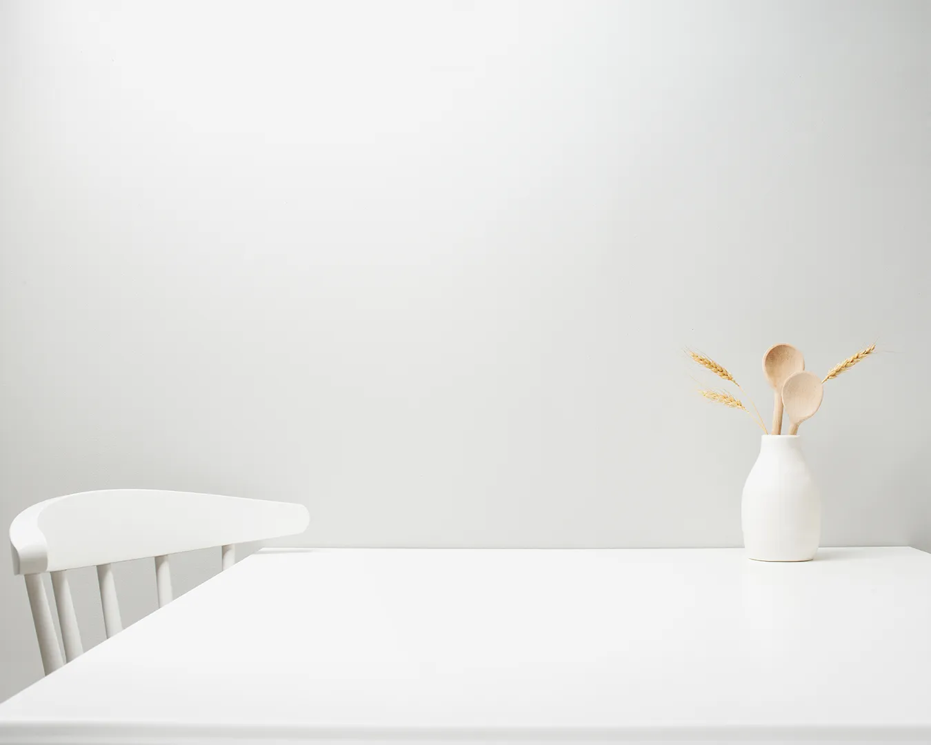 Minimalist restaurant table with clean white interior and simple décor, representing a modern dining space and restaurant SEO optimization for Singapore F&B businesses.