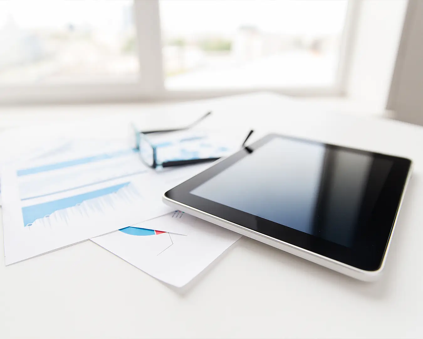 Tablet and laptop workspace for managing cloud POS subscriptions and business operations
