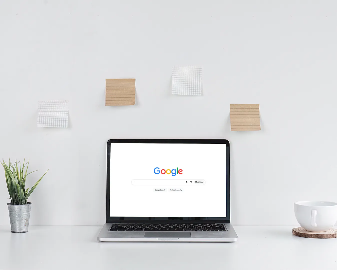 Minimal laptop displaying Google search on a clean white workspace, representing restaurant SEO, Google Business Profile optimisation, local search visibility, and digital branding.