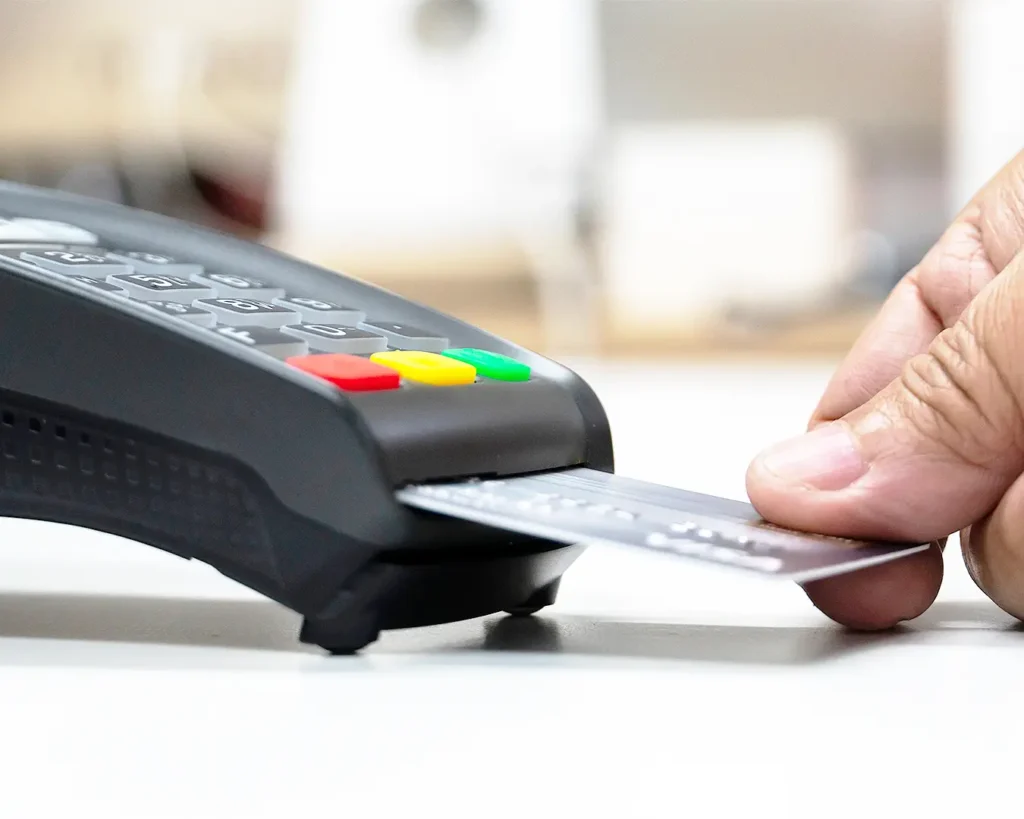 Customer using a card payment terminal for restaurant point-of-sale transactions