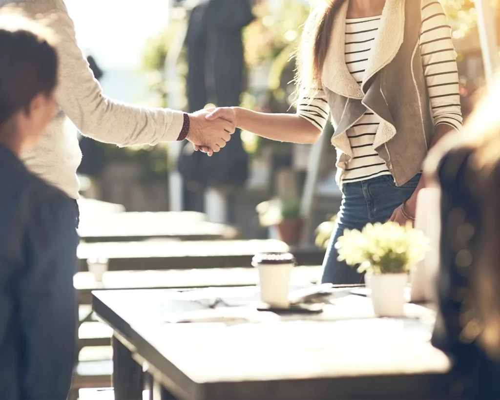 Restaurant server greeting a returning customer