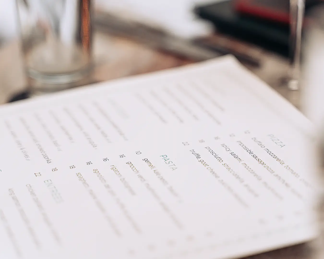 Restaurant menu featuring gourmet dishes and prices for menu psychology and customer spending