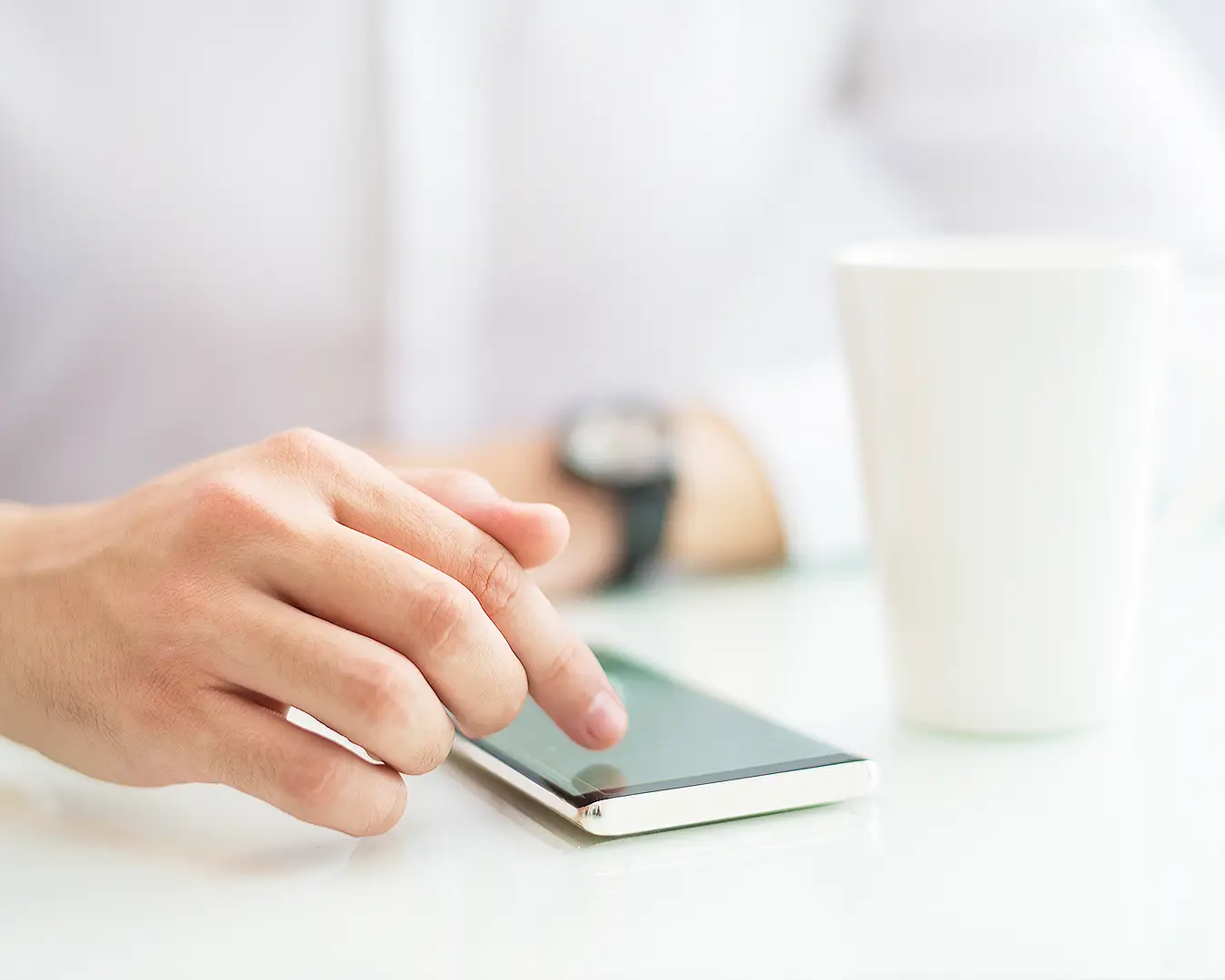 Customer using smartphone for restaurant communication, representing email and SMS marketing for repeat diners