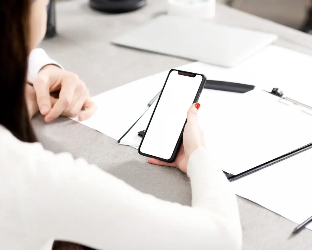 Business professional using smartphone for digital communication and marketing management