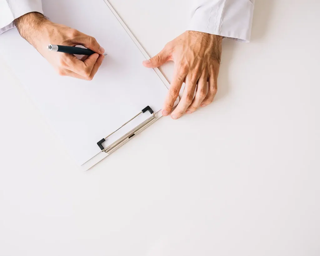 Business professional writing on a document during strategic planning and marketing analysis