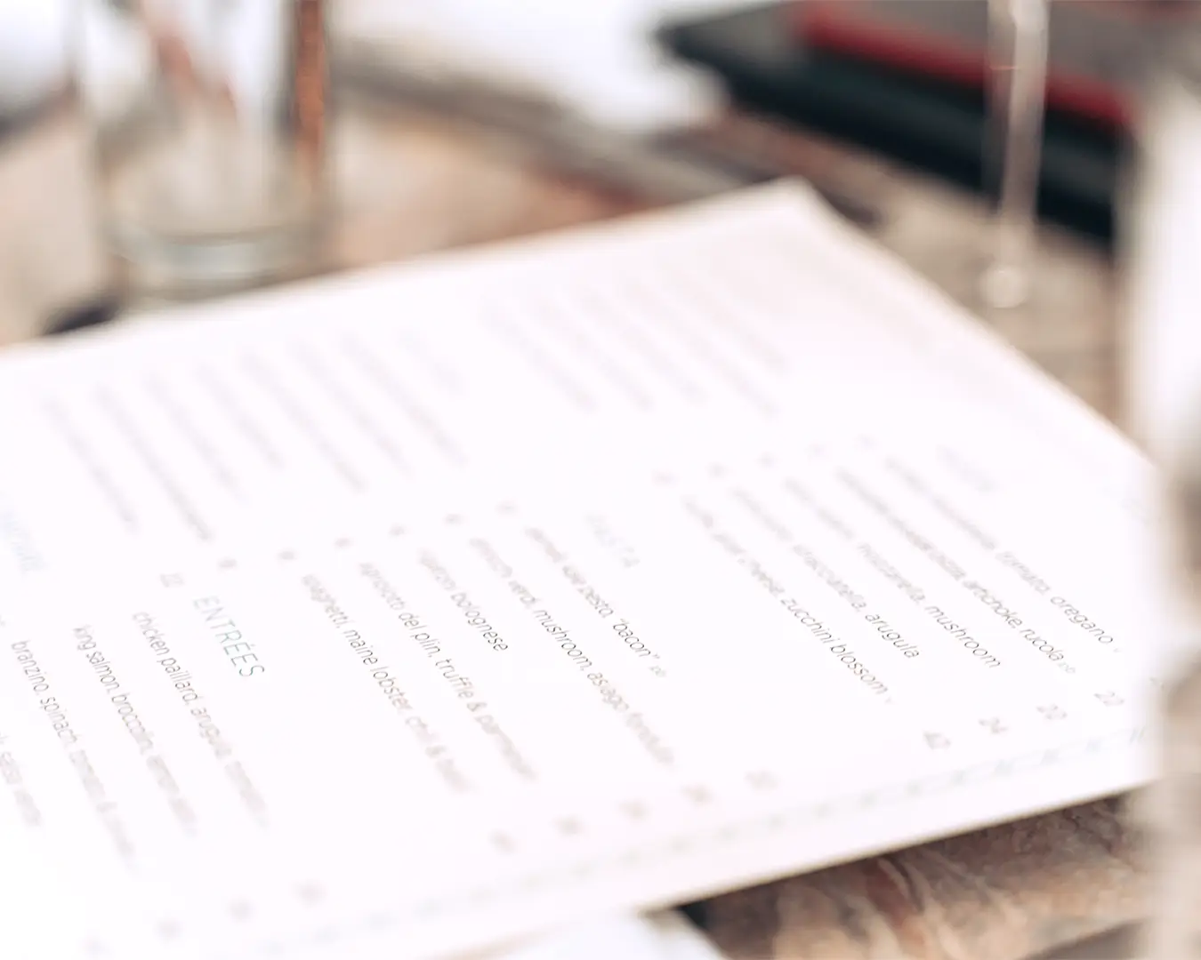Restaurant menu design with elegant typography for a refined dining brand identity