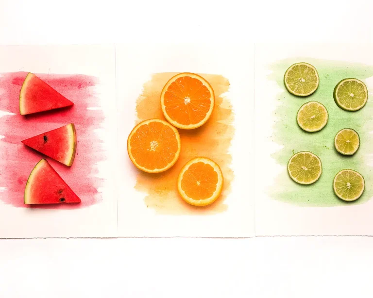 Colorful fruit slices in red, orange, and green tones illustrating restaurant brand colour palette choices and visual identity